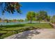 Scenic pond with a park bench and mature trees at 7808 E Lewis Ave, Scottsdale, AZ 85257