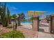 Gated community pool area with clear water and landscaping, promoting a safe and enjoyable recreational space at 7808 E Lewis Ave, Scottsdale, AZ 85257