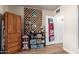 Room with sewing and quilting equipment, shelving for storing supplies, and natural light at 7808 E Lewis Ave, Scottsdale, AZ 85257