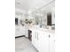 Modern bathroom with dual sinks, a vanity and a large mirror at 7860 E Camelback Rd # 404, Scottsdale, AZ 85251