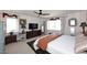Bright bedroom featuring a ceiling fan and ample natural light from the many windows at 7860 E Camelback Rd # 404, Scottsdale, AZ 85251