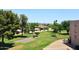 Scenic exterior shot of community with green landscape, mature trees and manicured grounds at 7860 E Camelback Rd # 404, Scottsdale, AZ 85251
