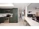 Kitchen featuring stainless steel appliances, breakfast bar, and seamless flow to living space at 7860 E Camelback Rd # 404, Scottsdale, AZ 85251