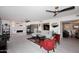 Spacious living room with stylish decor, fireplace, and open layout to the kitchen and dining area at 7860 E Camelback Rd # 404, Scottsdale, AZ 85251