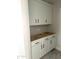 A close up of the kitchen's bright white cabinets and modern, black hardware at 820 W Lark Dr, Queen Creek, AZ 85140