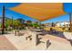 Amenity area featuring picnic tables, benches, barbecue grills, and shade canopies for outdoor activities at 8313 E Impala Ave, Mesa, AZ 85209