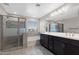 This primary bathroom showcases a walk-in shower, soaking tub, and double sink vanity at 8313 E Impala Ave, Mesa, AZ 85209