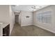 This bedroom features neutral walls, carpet, and a ceiling fan providing a clean, modern look at 8313 E Impala Ave, Mesa, AZ 85209