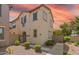 Inviting two-story home with desert landscaping and charming architectural details at 8313 E Impala Ave, Mesa, AZ 85209