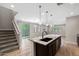 Well-designed kitchen open to living area with granite island and modern finishes at 8313 E Impala Ave, Mesa, AZ 85209
