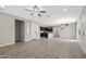 A spacious living room with tile floors seamlessly connecting to the kitchen area at 8313 E Impala Ave, Mesa, AZ 85209