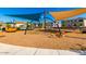 Community playground with climbing structures and shade canopies creates a fun and safe play environment at 8313 E Impala Ave, Mesa, AZ 85209