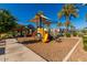 Community playground with a slide and other playground equipment, creating a fun space for children at 8313 E Impala Ave, Mesa, AZ 85209