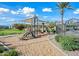 Community playground with slides, play structures, and shade canopies encourages active outdoor fun for families at 8313 E Impala Ave, Mesa, AZ 85209