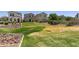 Spacious community yard with lush green grass at 8313 E Impala Ave, Mesa, AZ 85209