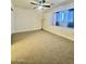 Bright bedroom offering plush carpeting, a ceiling fan, and a cozy window seat for added charm at 8874 N 48Th Ln, Glendale, AZ 85302