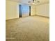 Large bedroom with a ceiling fan and plush carpeting with a light and airy feel at 8874 N 48Th Ln, Glendale, AZ 85302