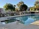 Community pool and spa offer a serene setting with seating, perfect for leisure and social gatherings at 8874 N 48Th Ln, Glendale, AZ 85302