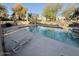 Sparkling community pool with lounge chairs for relaxing on a sunny day at 8874 N 48Th Ln, Glendale, AZ 85302
