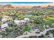 Expansive aerial view of golf course community nestled among desert landscape at 10772 E Running Deer Trl, Scottsdale, AZ 85262