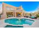 Backyard oasis with pool, patio seating, and desert views at 10772 E Running Deer Trl, Scottsdale, AZ 85262