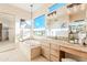 Bright bathroom featuring a soaking tub, dual sinks, and tiled countertops at 10772 E Running Deer Trl, Scottsdale, AZ 85262