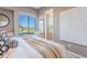 Bright bedroom featuring an ensuite, neutral walls, and a beautiful desert view at 10772 E Running Deer Trl, Scottsdale, AZ 85262