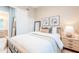 Comfortable bedroom featuring a wood frame bed, plantation shutters, and neutral decor at 10772 E Running Deer Trl, Scottsdale, AZ 85262