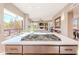 Kitchen featuring a center island with gas cooktop and views to the dining room and living room at 10772 E Running Deer Trl, Scottsdale, AZ 85262