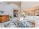 Spacious living room with a high ceiling, nice area rug, and comfortable white sofa at 10772 E Running Deer Trl, Scottsdale, AZ 85262
