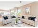 Bright living room boasts lots of natural light and comfortable seating at 10772 E Running Deer Trl, Scottsdale, AZ 85262
