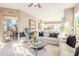 Bright, spacious living room with open floorplan, comfortable seating, and stairs to upper floor at 10772 E Running Deer Trl, Scottsdale, AZ 85262