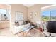 Cozy living room with a white sofa, rug, and scenic outdoor views at 10772 E Running Deer Trl, Scottsdale, AZ 85262