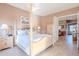 Inviting main bedroom with a four-poster bed, bedside tables and desert views at 10772 E Running Deer Trl, Scottsdale, AZ 85262