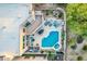 Aerial view of a private backyard with a pool, spa, patio seating, and lush desert landscaping at 10772 E Running Deer Trl, Scottsdale, AZ 85262
