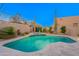 Backyard swimming pool and spa surrounded by desert landscaping and desert plants at 10772 E Running Deer Trl, Scottsdale, AZ 85262