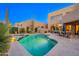 Beautiful backyard with a pool, spa, desert landscaping, and outdoor seating at 10772 E Running Deer Trl, Scottsdale, AZ 85262