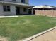 Large backyard with grass and covered patio for entertaining at 10956 E Thunderbolt Ave, Mesa, AZ 85212