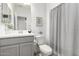 Bright bathroom featuring a modern vanity, decorative mirror, and stylish patterned flooring at 10956 E Thunderbolt Ave, Mesa, AZ 85212