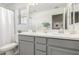 Bathroom featuring double sinks with gray cabinetry at 10956 E Thunderbolt Ave, Mesa, AZ 85212
