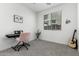 Bright room featuring a modern ceiling fan, music stand, and an acoustic guitar in corner at 10956 E Thunderbolt Ave, Mesa, AZ 85212