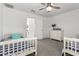 Bedroom with two twin beds and a dresser at 10956 E Thunderbolt Ave, Mesa, AZ 85212