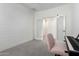 Bright bedroom featuring a sliding door, music stand, and a pink chair in corner at 10956 E Thunderbolt Ave, Mesa, AZ 85212