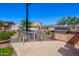 Community barbeque and seating area offering outdoor dining amidst scenic neighborhood views at 10956 E Thunderbolt Ave, Mesa, AZ 85212
