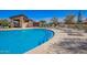 Beautiful community pool with inviting water, plenty of lounge chairs, and convenient pool-entry steps at 10956 E Thunderbolt Ave, Mesa, AZ 85212