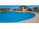 Open community pool area with clear, cool water and easy-access steps for a relaxing swim at 10956 E Thunderbolt Ave, Mesa, AZ 85212