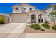 Beautiful two-story home featuring a two car garage, manicured front yard and inviting front porch at 10956 E Thunderbolt Ave, Mesa, AZ 85212