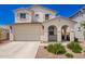 Charming two-story home featuring a two-car garage, landscaped front yard, and welcoming front porch at 10956 E Thunderbolt Ave, Mesa, AZ 85212