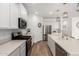 Bright kitchen featuring stainless steel appliances, quartz countertops, and stylish pendant lighting at 10956 E Thunderbolt Ave, Mesa, AZ 85212