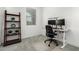Bright office space featuring a sleek work station, ergonomic chair, and stylish shelving unit at 10956 E Thunderbolt Ave, Mesa, AZ 85212